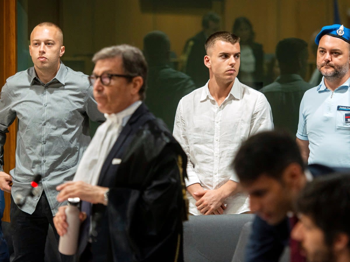 Finnegan Lee Elder, left, and Gabriel Natale Hjorth, centre, appear in court on 26 June 2024 (AP)
