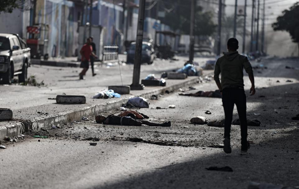 Dead bodies are seen on the Nasir street near the Al-Shifa hospital after an Israeli attack on its 34th day in Gaza City, Gaza on November 9, 2023. (Photo by Ali Jadallah/Anadolu via Getty Images)