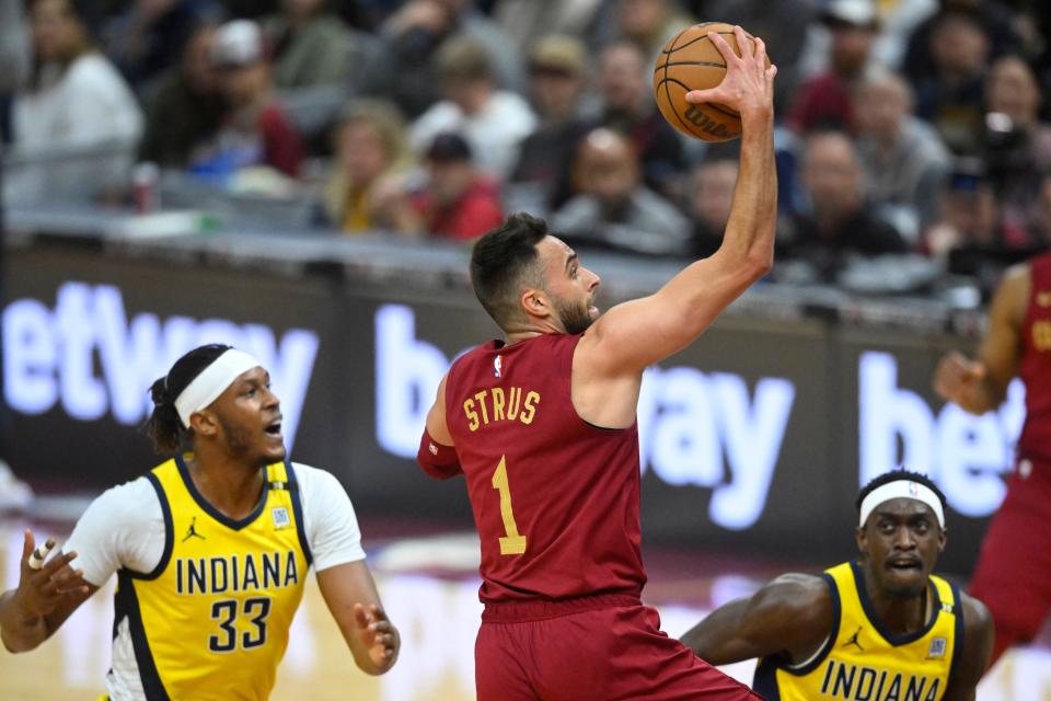 Apr 12, 2024; Cleveland, Ohio, USA; Cleveland Cavaliers guard Max Strus (1) drives to the basket between Indiana Pacers center Myles Turner (33) and forward Pascal Siakam (43) in the first quarter at Rocket Mortgage FieldHouse. Mandatory Credit: David Richard-USA TODAY Sports
