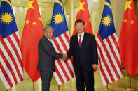 Chinese President Xi Jinping shakes hands with Malaysian Prime Minister Mahathir Mohamad before the bilateral meeting of the Second Belt and Road Forum at the Great Hall of the People in Beijing, China, April 25, 2019. Andrea Verdelli/Pool via REUTERS *** Local Caption *** BEIJING, CHINA - APRIL 25: Chinese President Xi Jinping shakes hands with Malaysian Prime Minister Mahathir Mohamad before the bilateral meeting of the Second Belt and Road Forum at the Great Hall of the People on April 25, 2019 in Beijing, China. (Photo b