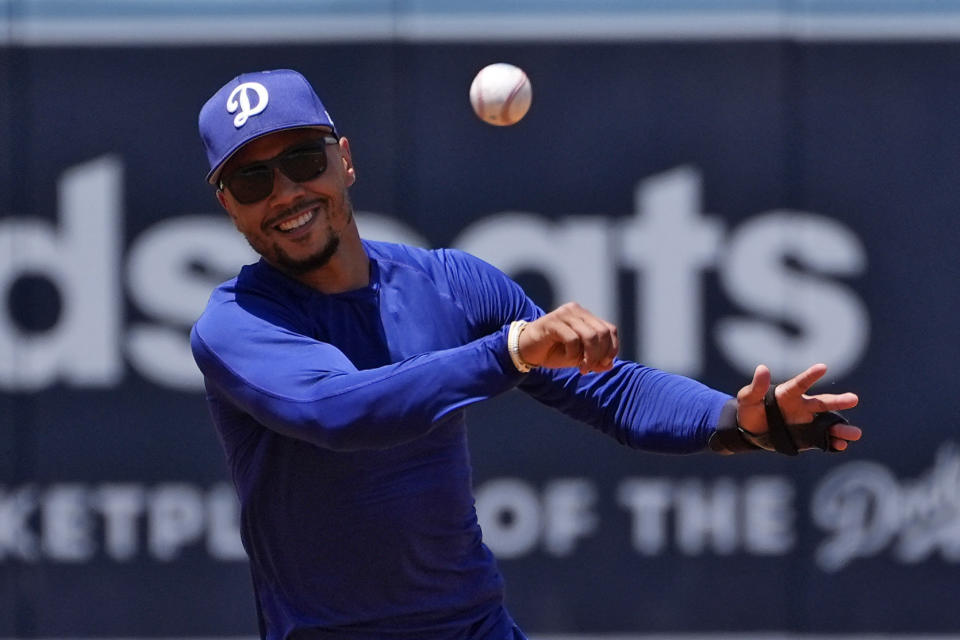 Mookie Betts of the Los Angeles Dodgers trains before a baseball game against the Milwaukee Brewers on Saturday, July 6, 2024, in Los Angeles. (AP Photo/Mark J. Terrill)