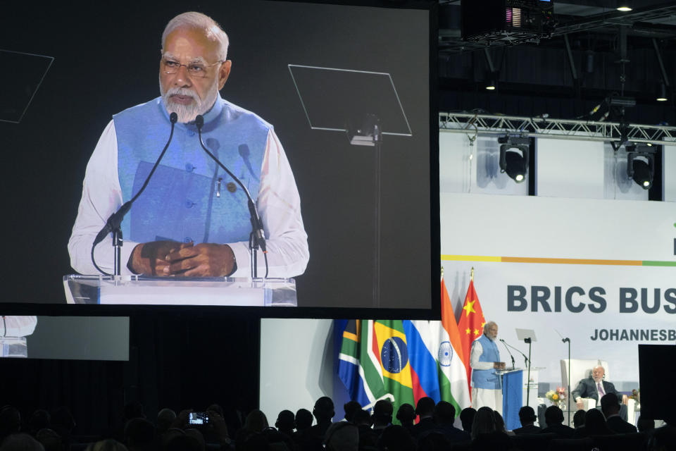 Indian Prime Minister Narendra Modi addresses leaders from the BRICS group of emerging economies at the start of a three-day summit in Johannesburg, South Africa, Tuesday, Aug. 22, 2023. (AP Photo/Jerome Delay)