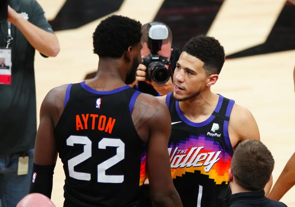 The Suns young duo of Dandre Ayton (22) and Devin Booker vowed to learn from the experience of falling short in their first NBA Finals.