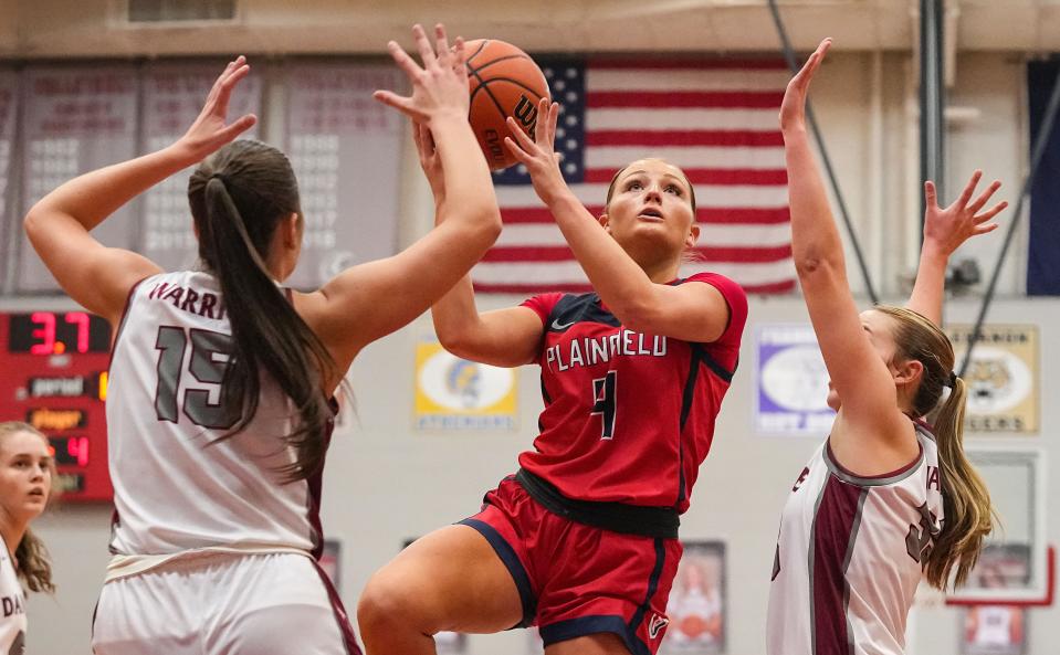 Plainfield Quakers Berkeley Williams (4) attempts to score against Danville's forward Ava Walls (15) on Saturday, Jan. 6, 2024, during the game at Danville Community High School in Danville.