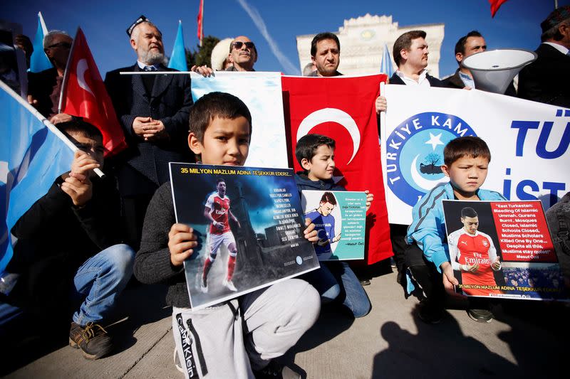 Ethnic Uighur demonstrators attend a protest against China in Istanbul