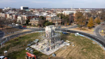 Workers install scaffolding as they prepare to remove the pedestal that once held the statue of Confederate General Robert E. Lee on Monument Avenue Monday Dec 6, 2021, in Richmond, Va. Virginia Gov. Ralph Northam ordered the pedestal removed and the land granted to the City of Richmond. (AP Photo/Steve Helber)