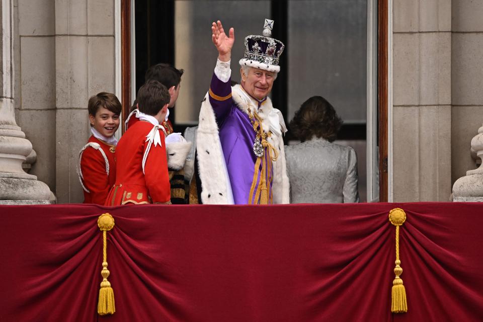 <p>Britain's King Charles III wearing the Imperial state Crown, waves from the Buckingham Palace balcony after viewing the Royal Air Force fly-past in central London on May 6, 2023, after his coronation. - The set-piece coronation is the first in Britain in 70 years, and only the second in history to be televised. Charles will be the 40th reigning monarch to be crowned at the central London church since King William I in 1066. (Photo by Oli SCARFF / AFP) (Photo by OLI SCARFF/AFP via Getty Images)</p> 