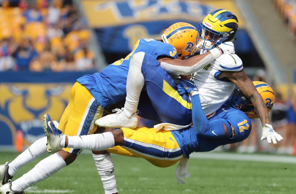 Delaware receiver Thyrick Pitts is tackled by Pitt's Damar Hamlin (left) and Paris Ford on a reception in the second quarter at Heinz Field. Pitt rallied to beat the Blue Hens 17-14 in the 2019 game.