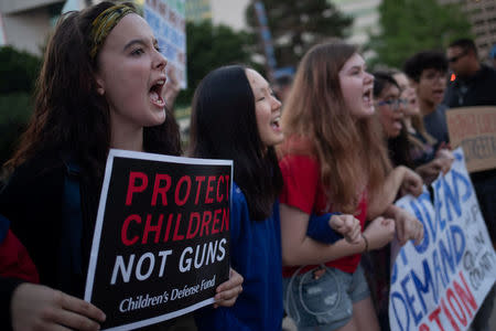 Activists shout slogans while taking part in a protest march against the National Rifle Association (NRA) in Dallas, Texas, U.S., May 4, 2018. REUTERS/Adrees Latif