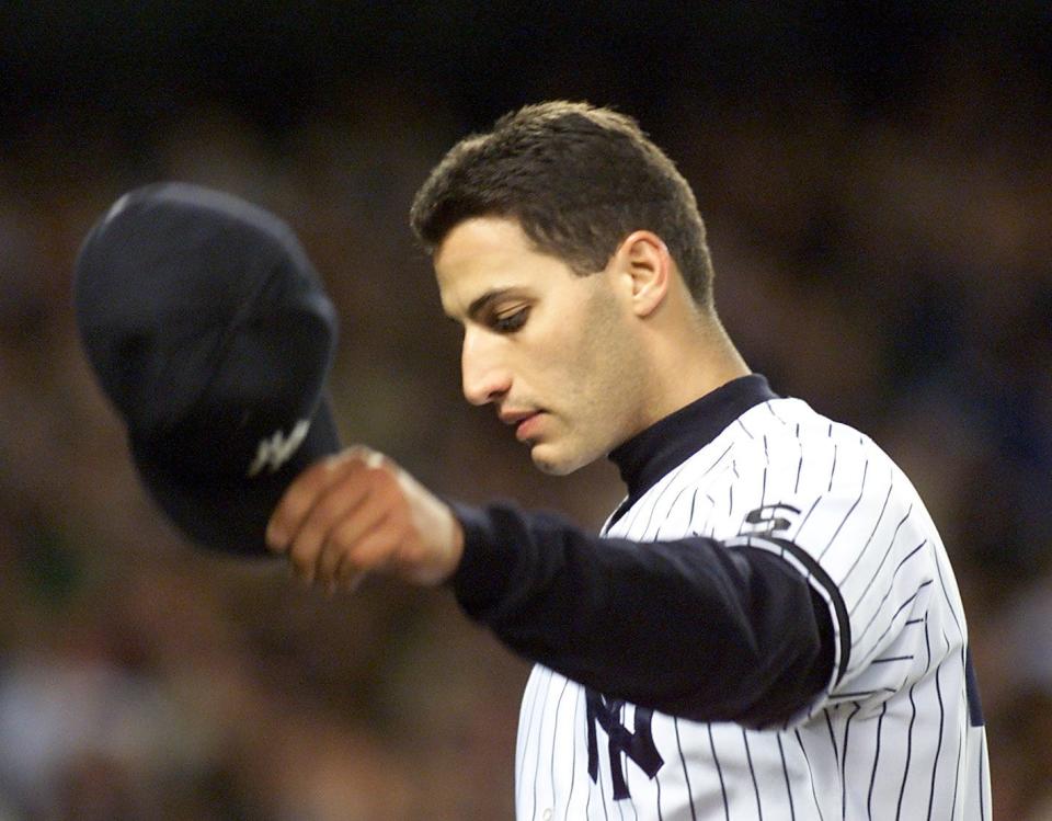 Yankees pitcher Andy Pettitte tips his hat after being taken out of the game 10/7/1999 at Yankee Stadium in the Bronx during Game 2 of the  American League Divisional Series. Texas Rangers at New York Yankees.