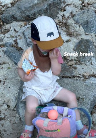 <p>Olivia Munn/Instagram</p> Olivia Munn's son Malcolm enjoys a snack break.
