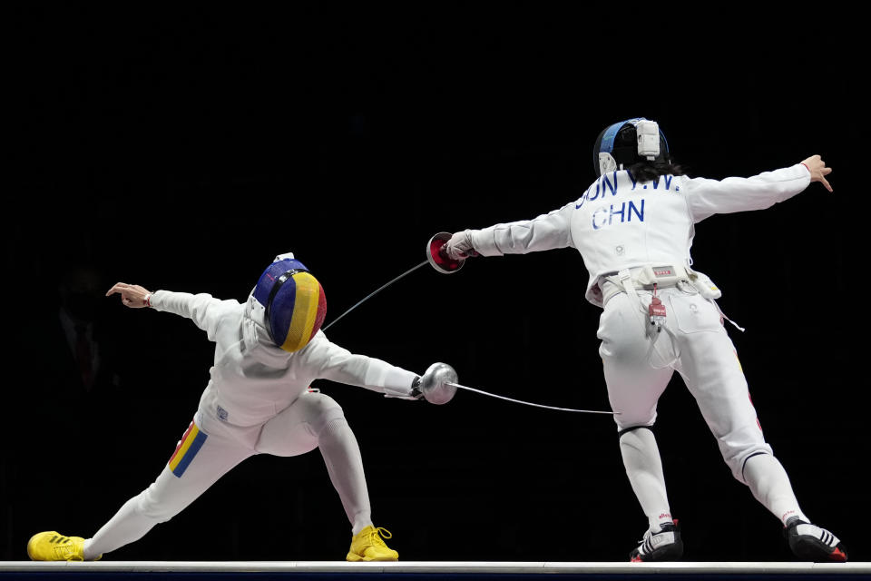 Ana Maria Popescu of Romenia, left, and Sun Yiwen of China compete in the women's individual Epee final competition at the 2020 Summer Olympics, Saturday, July 24, 2021, in Chiba, Japan. (AP Photo/Andrew Medichini)