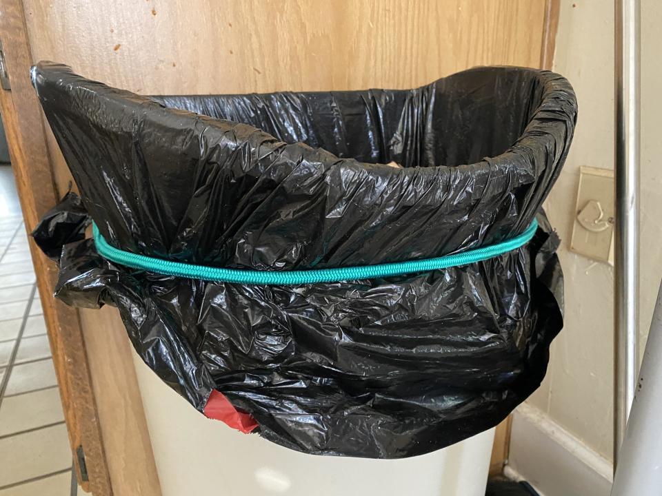 a bungee cord on a trash bag