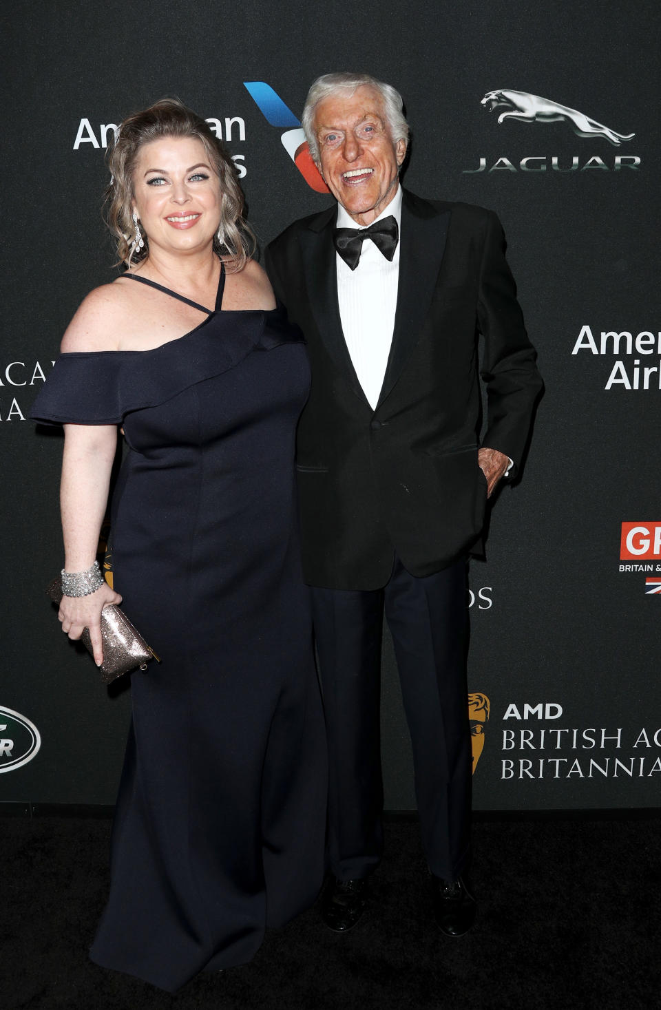Dick Van Dyke poses in a tuxedo next to wife Arlene Silver 