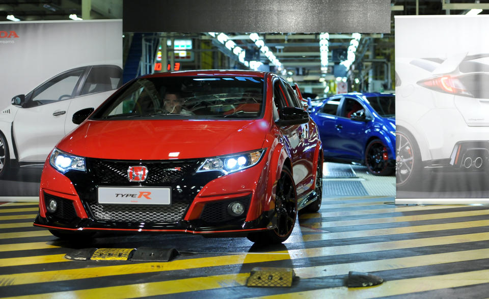 The first of three production models of the new Honda Civic Type R, which have been painted red, white and blue, rolls off the production line at Honda's UK manufacturing plant in Swindon.