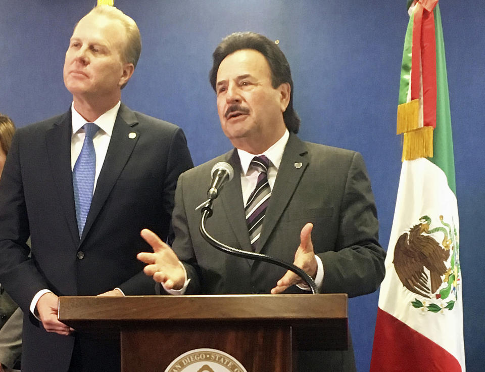 San Diego Mayor Kevin Faulconer, left, and Tijuana, Mexico, Mayor Juan Manuel Gastelum discuss the benefits of cross-border ties at a news conference at San Diego City Hall, Monday, Feb. 6, 2017. The mayors of the largest metropolitan area on the U.S.-Mexico border called for stronger binational ties, striking a sharp contrast with U.S. President Donald Trump's calls to build a wall and renegotiate the North American Free Trade Agreement. (AP Photo/Elliot Spagat)