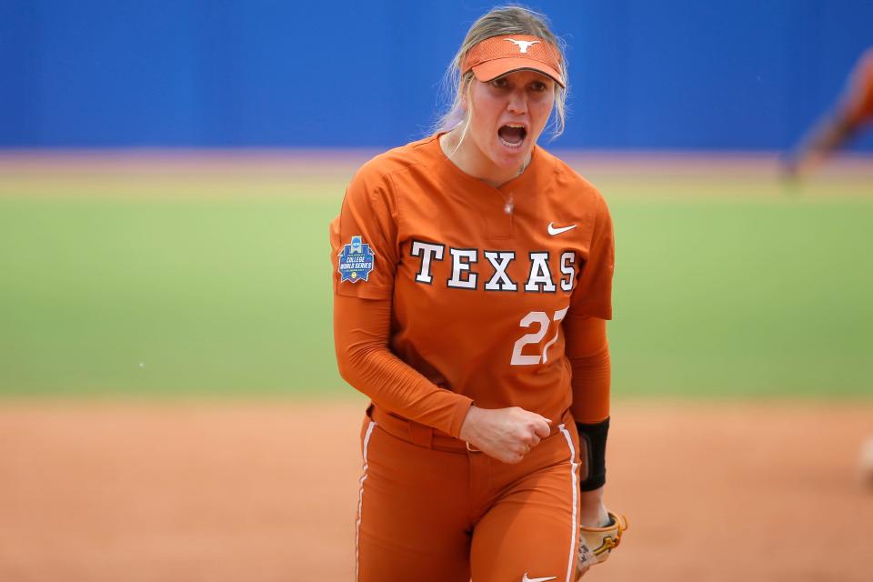 Texas' Hailey Dolcini celebrates after a 7-2 win against UCLA on Thursday in the WCWS opener.