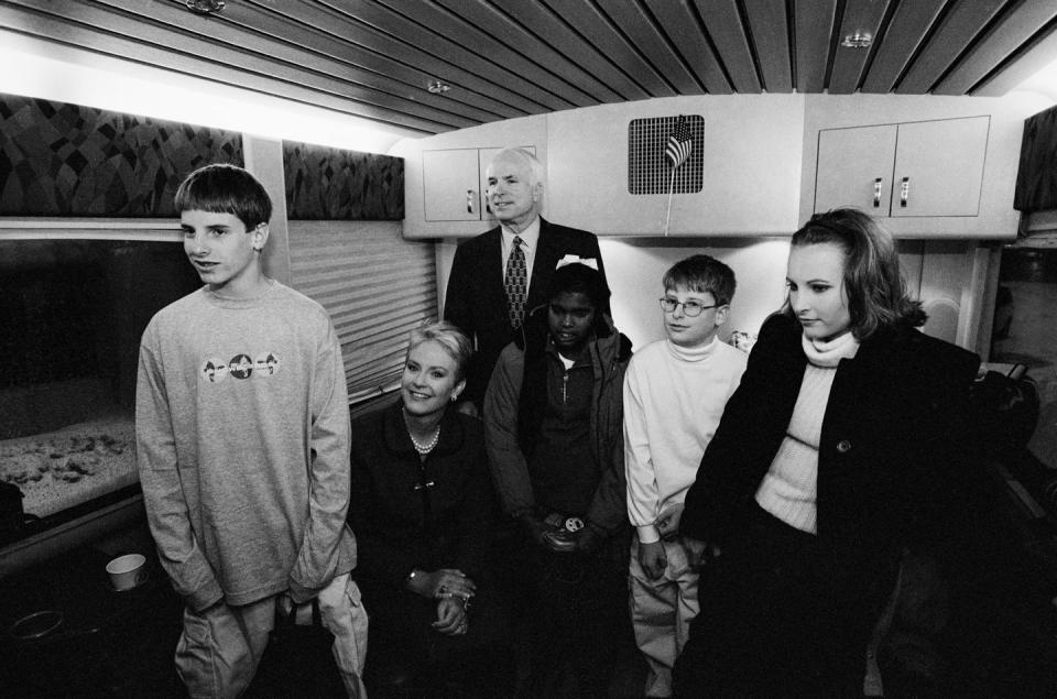 <p>McCain on his campaign bus with his family: (L-R) son Jack, wife Cindy, daughter Bridget, son Jimmy and daughter Meghan, on January 31, 2000 in Keene, New Hampshire. </p>