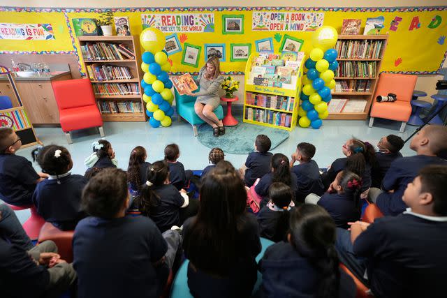 <p>S. Savenok/Getty Images for Little Yellow Libraries</p> Jenna Bush Hager reading to kids at P.S. 108K in Brooklyn