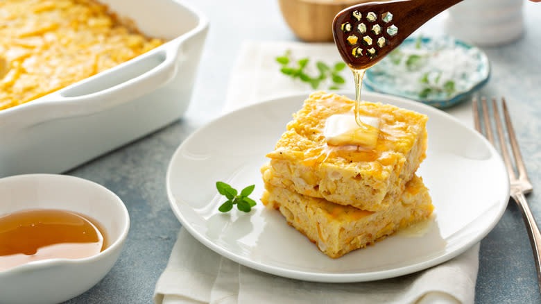 Cornbread on plate with honey 