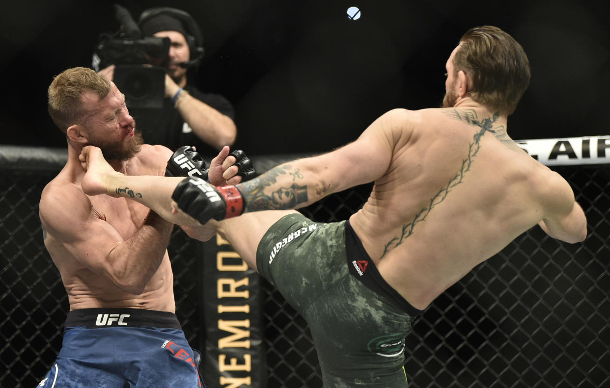 LAS VEGAS, NEVADA - JANUARY 18: Conor McGregor of Ireland kicks Donald Cerrone in their welterweight fight during the UFC 246 event at T-Mobile Arena on January 18, 2020 in Las Vegas, Nevada. (Photo by Chris Unger/Zuffa LLC)