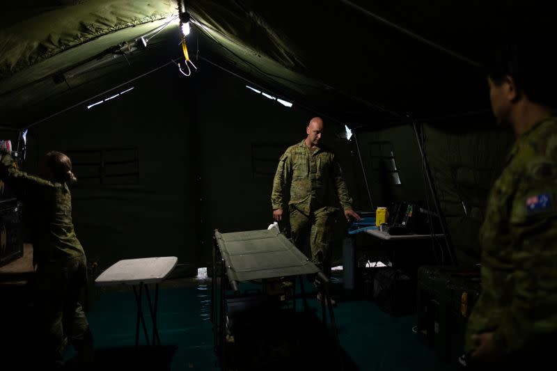 Members of a military support team prepare a field hospital at the town of Eden