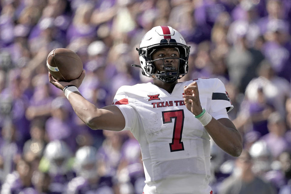 Texas Tech quarterback Donovan Smith throws for a touchdown during the first half of an NCAA college football game against Kansas State Saturday, Oct. 1, 2022, in Manhattan, Kan. (AP Photo/Charlie Riedel)