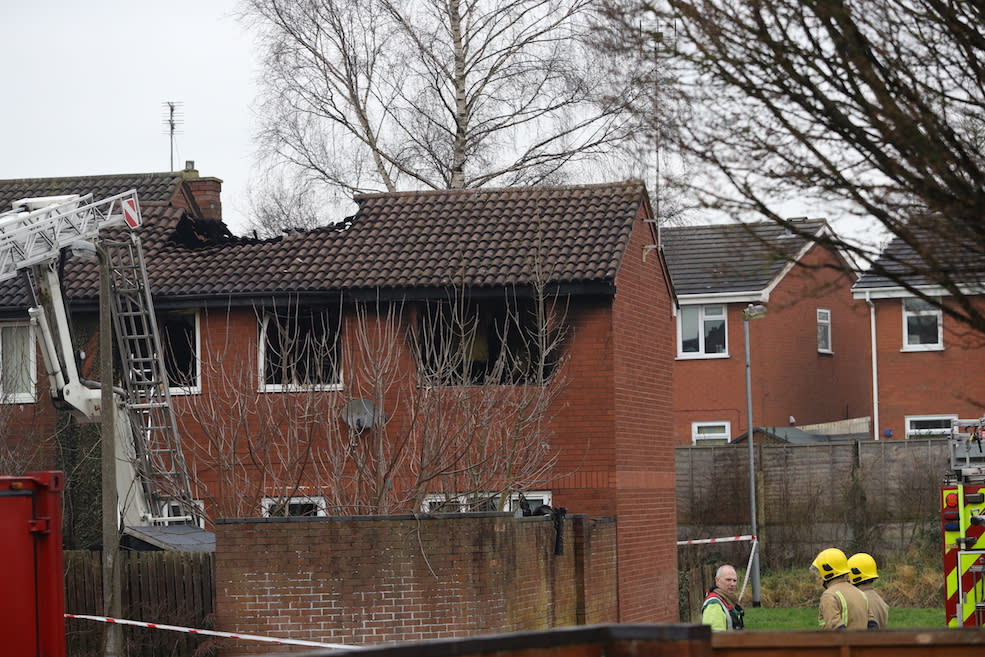 Firefighters at the scene of the house fire (Picture: PA)