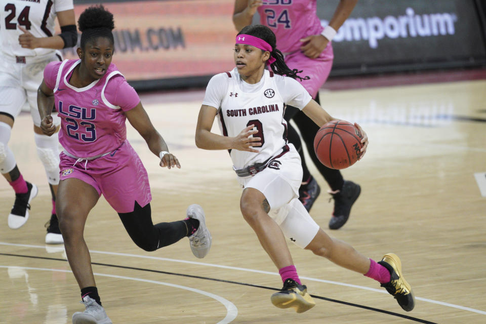 South Carolina guard Destanni Henderson (3) dribbles against LSU guard Karli Seay (23) during the first half of an NCAA college basketball game Sunday, Feb. 14, 2021, in Columbia, S.C. (AP Photo/Sean Rayford)