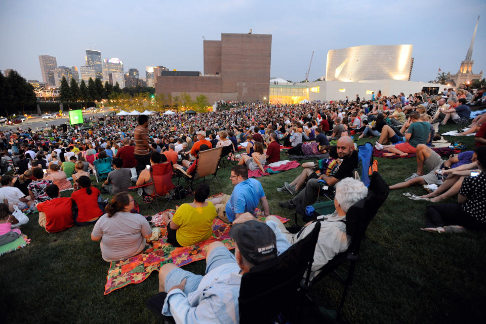 An estimated crowd of 6000 gathered at sundown outside the Walker Art Center for the first "Internet Cat Video Film Festival," showcasing the best of cat films on the Internet in Minneapolis Thursday, Aug. 30, 2012. The Walker Art Center in Minneapolis held its first-ever online cat video festival, a compilation of silly cat clips that have become an Internet phenomenon, attracting millions of viewers for some of the videos. (AP Photo/Craig Lassig)