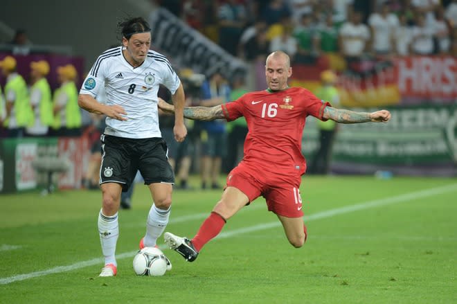 Portuguese midfielder Raul Meireles (R) vies with German midfielder Mesut Oezil during the Euro 2012 championships football match Germany vs Portugal on June 9, 2012 at the Arena Lviv. AFP PHOTO / DAMIEN MEYERDAMIEN MEYER/AFP/GettyImages