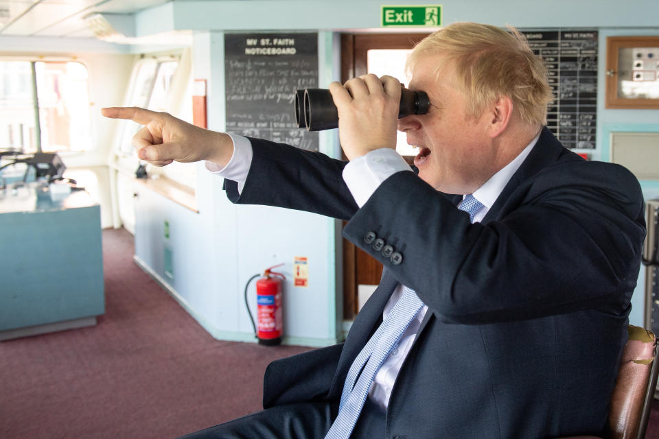 Conservative leadership candidate Boris Johnson looks through binoculars on the bridge of the Isle of Wight ferry as it sets sail from Portsmouth.