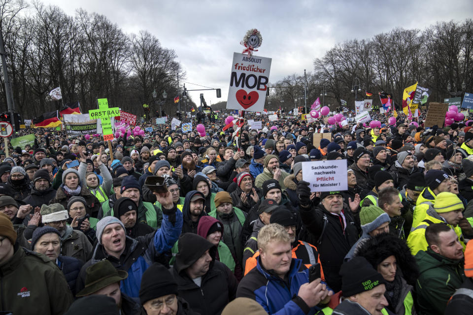 Farmers attend a protest in Berlin, Germany, Monday, Jan 15, 2024. This week began and ended with the long road in front of Berlin’s landmark Brandenburg Gate thronged by heavy vehicles tooting their horns in protest — farmers on Monday Jan. 15 and truckers on Friday Jan. 19, 2024. Such demonstrations underline deep frustration in Germany with Chancellor Olaf Scholz’s government, which came to power just over two years ago with a progressive, modernizing agenda but has come to be viewed by many as dysfunctional and incapable. (AP Photo/Ebrahim Noroozi, File)