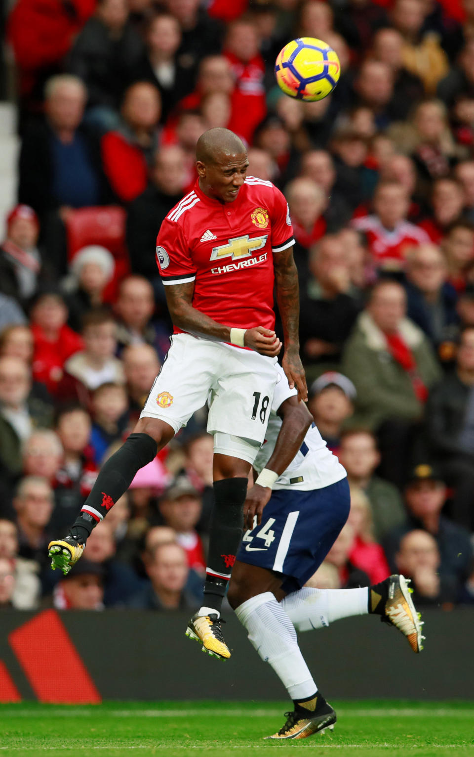 <p>Manchester United’s Ashley Young heads clear</p>