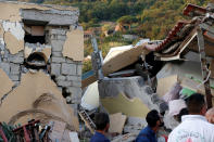 <p>Collapsed houses are seen after an earthquake hits the island of Ischia, off the coast of Naples, Italy, Aug. 22, 2017. (Photo: Ciro De Luca/Reuters) </p>