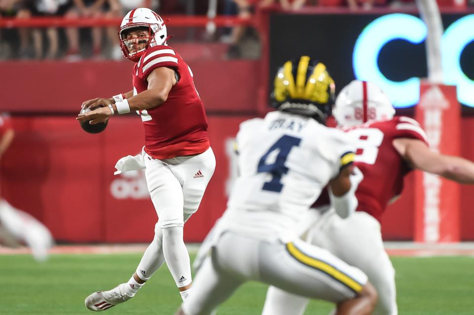 Quarterback Adrian Martinez of the Nebraska Cornhuskers passes against the Michigan Wolverines in the first half at Memorial Stadium on Saturday, Oct. 9, 2021 in Lincoln, Nebraska.