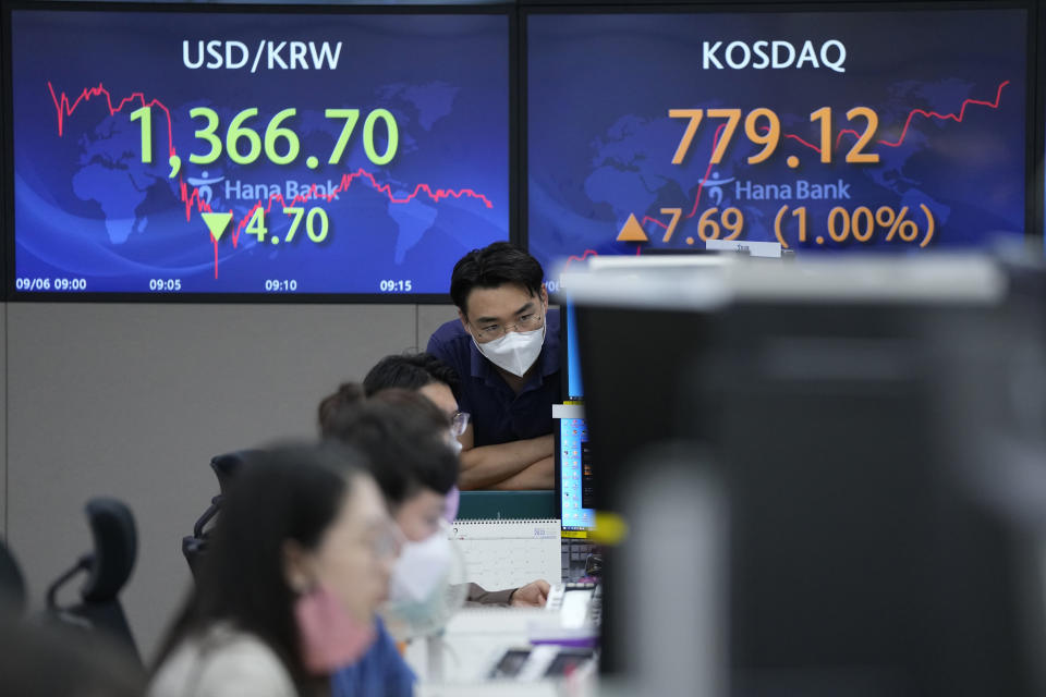 A currency trader watches monitors at the foreign exchange dealing room of the KEB Hana Bank headquarters in Seoul, South Korea, Tuesday, Sept. 6, 2022. (AP Photo/Ahn Young-joon)