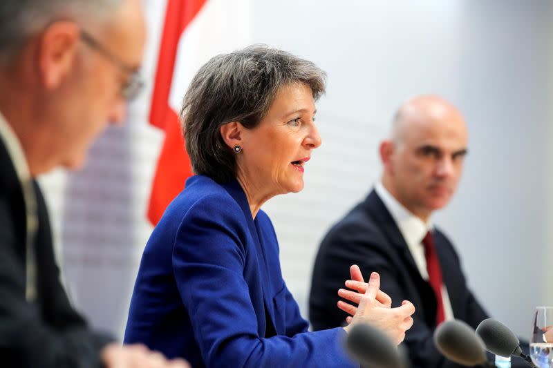 Swiss Interior Minister Alain Berset, Swiss President Simonetta Sommaruga and Swiss Economic Minister Guy Parmelin hold a news conference, in Bern