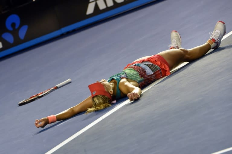 Germany's Angelique Kerber celebrates her victory during the women's singles final against Serena Williams of the US on day thirteen of the 2016 Australian Open tennis tournament in Melbourne on January 30, 2016