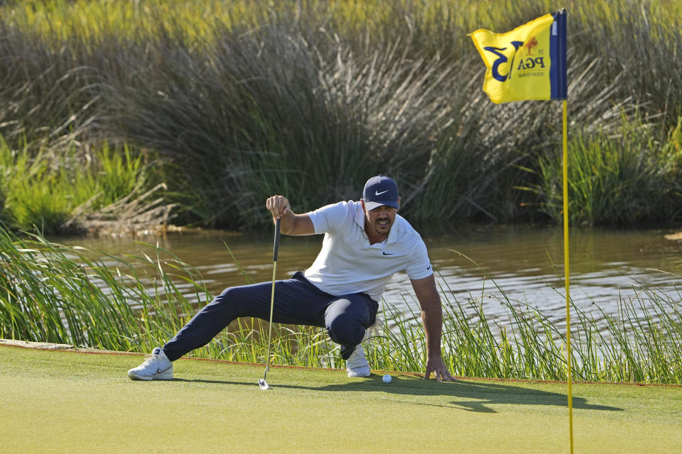 Brooks Koepka reads his birdie putt on the 13th hole during the second round of the PGA Championship golf tournament on the Ocean Course Friday, May 21, 2021, in Kiawah Island, S.C. (AP Photo/David J. Phillip)