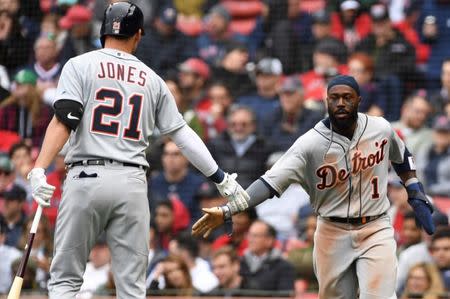 Apr 23, 2019; Boston, MA, USA; Detroit Tigers center fielder JaCoby Jones (21) congratulates second baseman Josh Harrison (1) after scoring a run during the eighth inning against the Boston Red Sox at Fenway Park. Mandatory Credit: Bob DeChiara-USA TODAY Sports