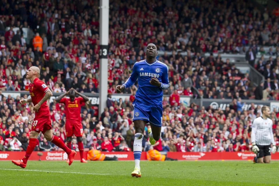 Chelsea's Demba Ba celebrates scoring against Liverpool during their English Premier League soccer match at Anfield Stadium, Liverpool, England, Sunday April 27, 2014. (AP Photo/Jon Super)