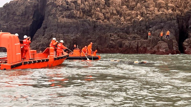 Members of Taiwan's coast guard work during a rescue operation after a boat capsized near Taiwan-controlled Kinmen islands
