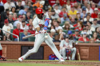 Philadelphia Phillies' Johan Rojas hits an RBI single during the fifth inning of a baseball game against the St. Louis Cardinals, Monday, April 8, 2024, in St. Louis. (AP Photo/Scott Kane)