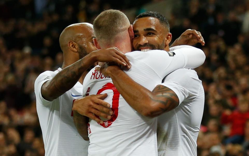 Callum Wilson celebrates making it England 3 USA 0 with Wayne Rooney on his farewell appearance. - AFP