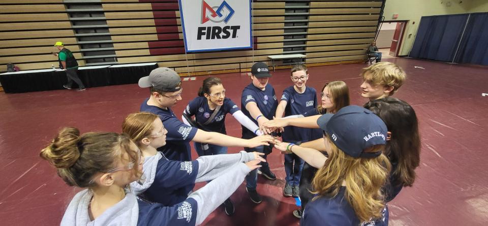 Livingston County will be represented by a STEAM Syndicate high school team at the FRC World Championships this week in Houston.  From left to right around the circle - Alaina Reynolds, Keira Chapel, Logan Chapel, Coach Becky Linton, Brendan Bertan, Aiden Gorang, Elizabeth Arrowood, Charlie Moore, Joey Linton and Carter Leestma