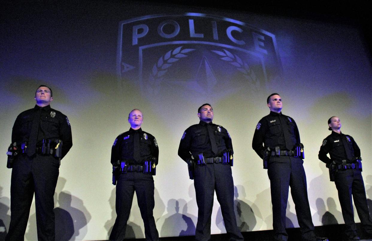 From left, Class 60 of the Abilene Police Department academy graduated nine cadets Thursday night - from left, Chaz Busse, Sarah Church, Pablo Garza Jr., Jonathan Hoover and Brookyn Kanady. The new officers were given badges and pinned during the ceremony at the Paramount Theatre.
