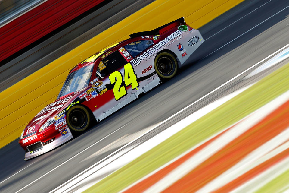 CHARLOTTE, NC - OCTOBER 13: Jeff Gordon drives the #24 Drive to End Hunger/Chevy 100th Anniversay Chevrolet during practice for the NASCAR Sprint Cup Series Bank of America 500 at Charlotte Motor Speedway on October 13, 2011 in Charlotte, North Carolina. (Photo by Geoff Burke/Getty Images for NASCAR)