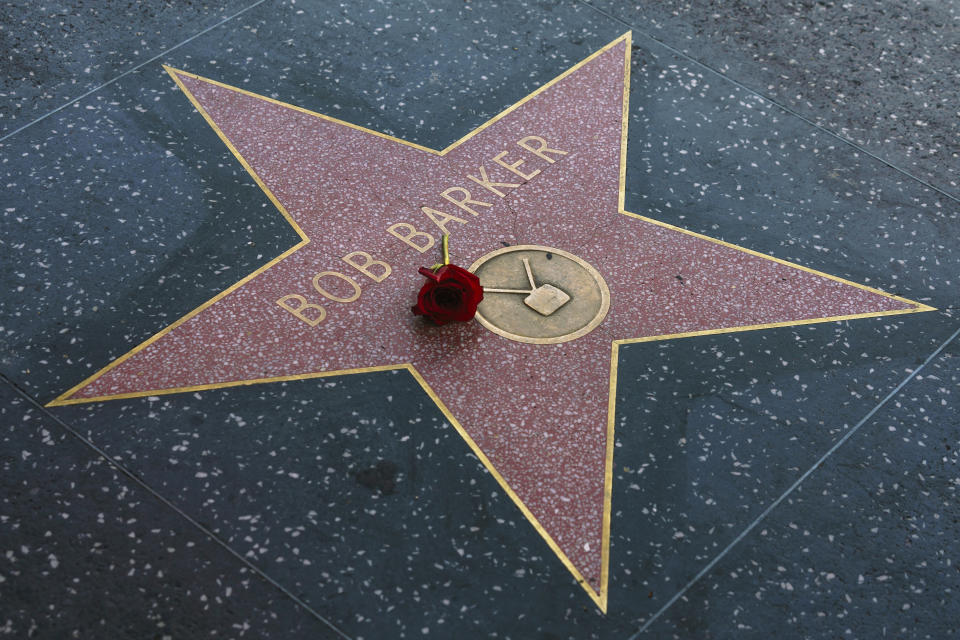 A rose lies on the Walk of Fame star of popular game show host Bob Barker, in Los Angeles, Saturday, Aug. 26, 2023. A publicist says Barker, a household name for a half-century as host of "Truth or Consequences" and "The Price Is Right," has died at his home in Los Angeles. Barker was 99. (AP Photo/Damian Dovarganes)