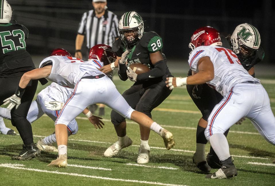 McNair's Robert Crawford, center, is swarmed by East Union defenders.